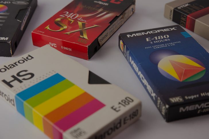 vhs-banner Various VHS tapes laid out on a white table
