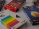 Various VHS tapes laid out on a white table